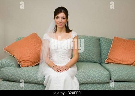 A bride sitting on the couch Stock Photo
