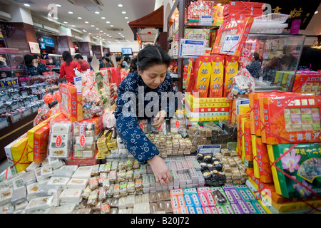 One hundred year old sweet shop in the Yu Garden Bazaar Market Shanghai China Stock Photo