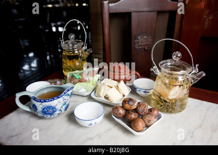 Flower infused teas and traditional snacks in the Huxinting Teahouse Yu Garden Bazaar Market Shanghai China Stock Photo