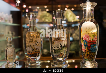 Glass bottles hand painted on the inside displayed in Beijing Dragon Land jade gallery in Beijing China Stock Photo