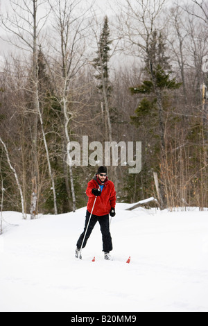 A man cross country skiing on the Catamount Trail in Stowe, Vermont Stock Photo