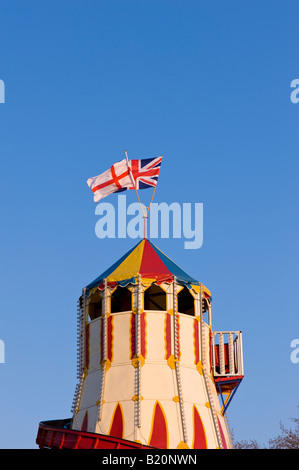 English and British flags on top of funfair castle Ealing W5 London United Kingdom Stock Photo