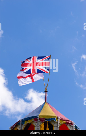 British and English flags on a funfair castle Ealing W5 London United Kingdom Stock Photo