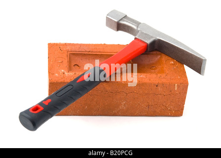 Brick hammer and brick Stock Photo