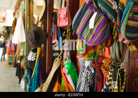 SPAIN Madrid Colorful fabric scarves and bags hanging on retail store merchandise displayed Stock Photo
