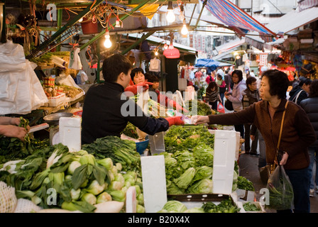 Fruit and vegetables on sale in old Chinese Soho food market in Graham Street Central Hong Kong China Stock Photo