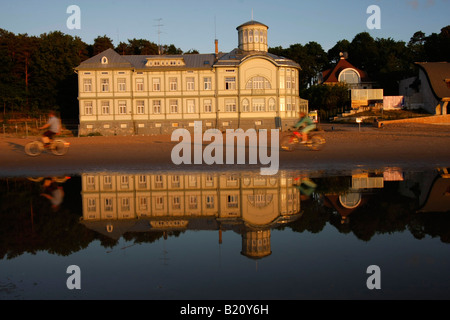 former bath house of E Racene reflecting in the shallow water at the beach in Jurmala Latvia Baltic states Stock Photo