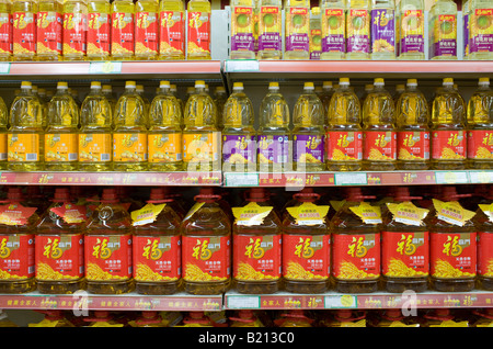 Cooking oils in supermarket China The Chinese use a lot of edible oil and find it an expensive item Stock Photo