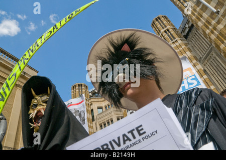 Fat Cat and Grim Reaper at London Keep our NHS Public demo on 60th anniversary of NHS outside Richmond House, Whitehall NHS HQ Stock Photo