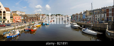 A 2 picture stitch panoramic view of the 17th century old harbour of Weymouth taken from the Westham bridge. Stock Photo