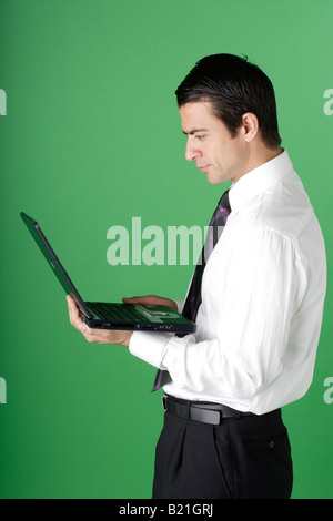 Young businessman looking at a computer screen Stock Photo