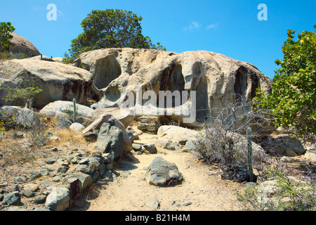 Large boulders make up this odd rock formation at the Arikok National Park Stock Photo