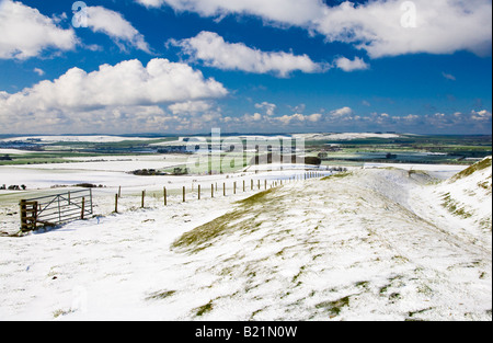 Snow over the Marlborough Downs in Wiltshire, England, UK taken from a rampart at Liddington Castle, an iron age hillfort. Stock Photo