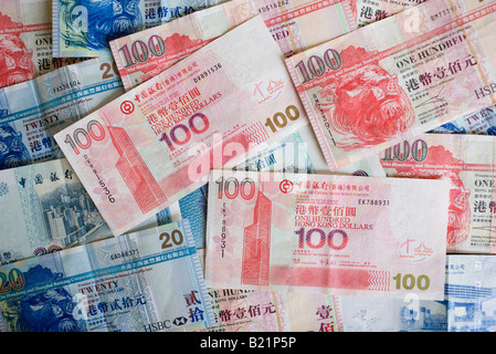 Hong Kong Dollar bills feature image of the Bank of China Building Hong Kong China Stock Photo