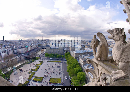 Notre Dame Cathedral gargoyles on exterior with scenic panoramic view over Paris France Europe Stock Photo