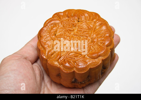 hand holding mooncake Stock Photo
