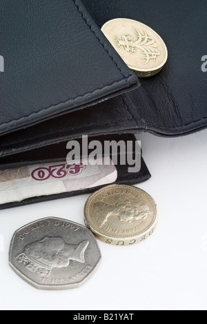 Pound coins in a purse Stock Photo - Alamy