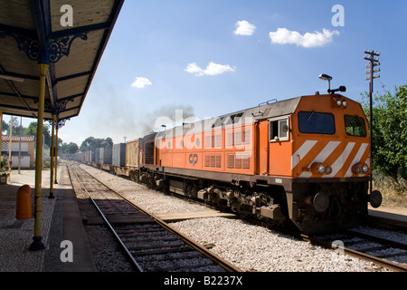 Diesel locomotive (model 1960 - bombardier) with a freight train from Comboios de Portugal. (Portuguese trains). Crato station. Stock Photo