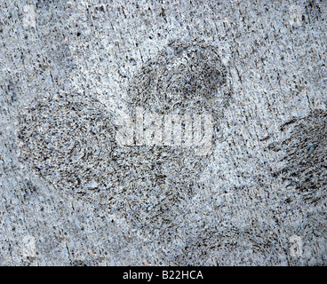 A heart shape hand formed on dried cement Stock Photo