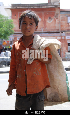 Little Indian poor boy in streets of Jaipur Stock Photo