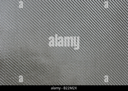 Close up image of fiberglass cloth. This cloth, a bi-directional fiber weave (BID) is commonly used for composite structures. Stock Photo