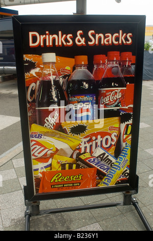 A sign advertises snack and beverage choices outside a Gulf gas station in New York NY Stock Photo