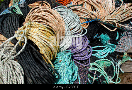A pile of colorful ropes used to attach lobster traps to buoys in South Bristol, Maine. Stock Photo