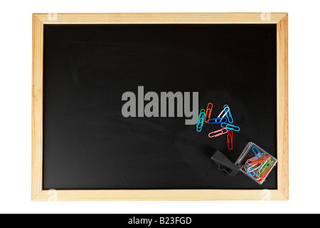 An empty black chalkboard with paperclips Isolated on white background Stock Photo