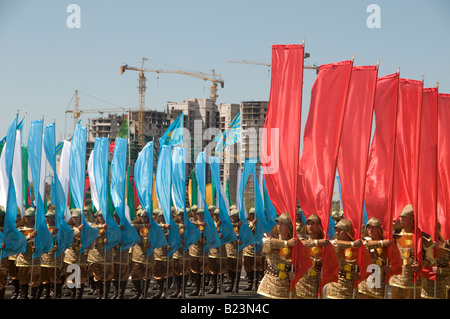 People dressed in traditional costumes participate in a ceremony at Kazakh Eli Square in Astana, Kazakhstan Stock Photo