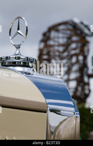 Mercedes badge and bonnet with Goodwood sculpture in background Stock Photo