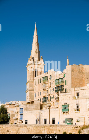 Historic church and fortification in Valletta, Malta overlooking the Grand Harbor. Stock Photo