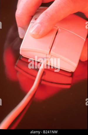 HAND ON COMPUTER MOUSE CLOSE UP MOUSE ERGONOMICS Stock Photo