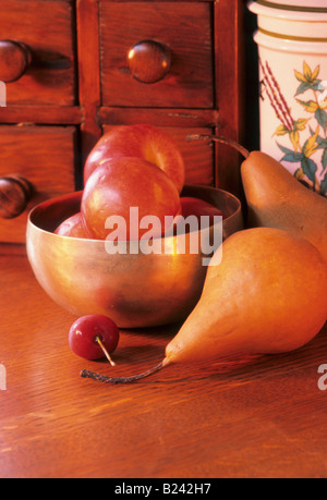 NECTARINES CHERRY PEARS SPICE RACK IN BACKGROUND Stock Photo