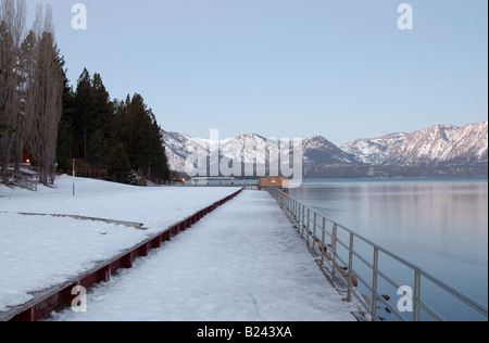A small marina it by the predawn moonlight at Lake Tahoe in winter Stock Photo