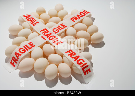 Fragile tape on eggs Stock Photo
