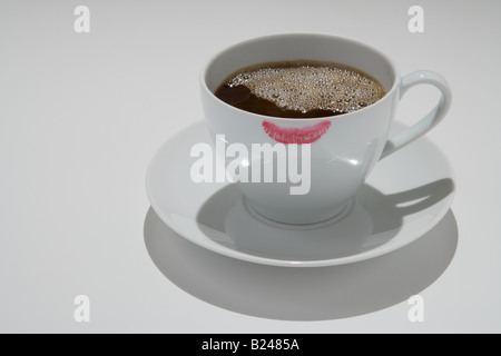 Lipstick on the edge of a coffee cup Stock Photo