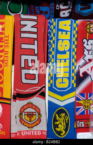 Football scarves on display on London tourist souvenir stall Stock Photo