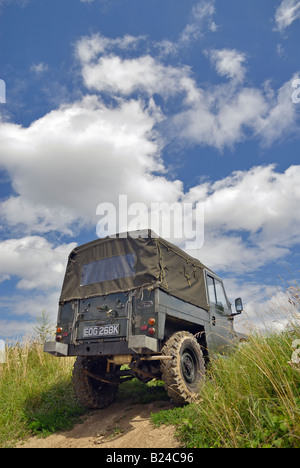 A 1960s Land Rover Lightweight Series 2a driving off road in Bining, France. Stock Photo