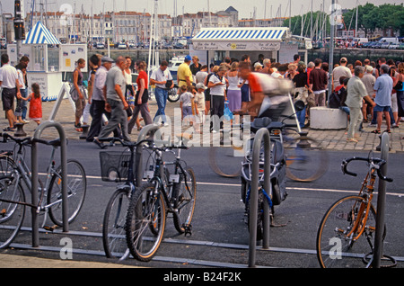 Crowds by La Rochelle harbour in France awaiting boat trips to nearby islands of Oleron, Aix, and Re Stock Photo