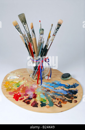 Artist s Palette and brushes over a white background Stock Photo