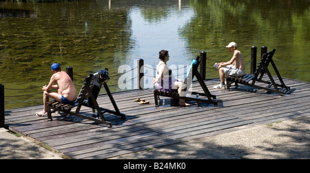 sunbathing in park Stock Photo