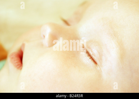 sleeping baby face during day time Stock Photo
