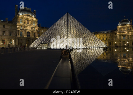 The Louvre Pyramid in Paris France Stock Photo