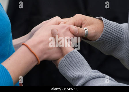 Couple massaging each others hands Close up 2008 UK HOMER SYKES Stock Photo