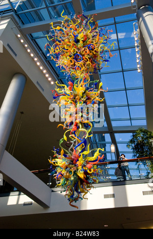 Glass sculpture by glass artist Dale Chihuly hangs in the atrium of Lincoln Square in downtown Bellevue Washington Stock Photo