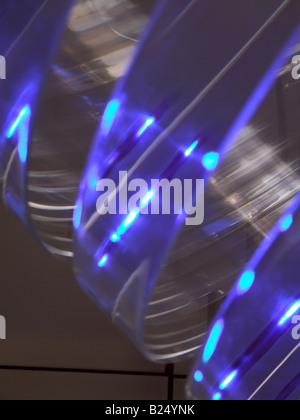 blue laser rays on round cylinder wheel glass Stock Photo