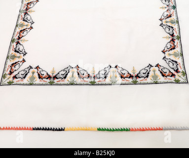 Greek Cross Stitch Embroidered Tray Cloth with Chickens Stock Photo
