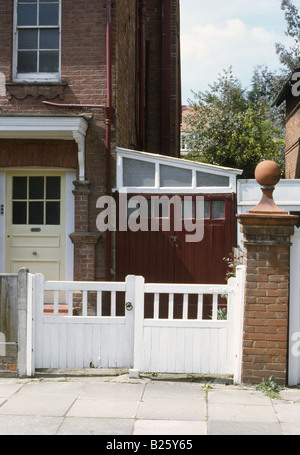 Bedford Park west London Uk England English lean to garage attached to end of terrace house Stock Photo