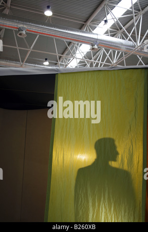 silhouette male model mannequin behind curtains Stock Photo