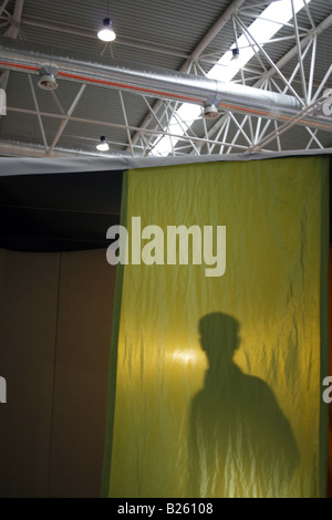 silhouette male model mannequin behind curtains Stock Photo